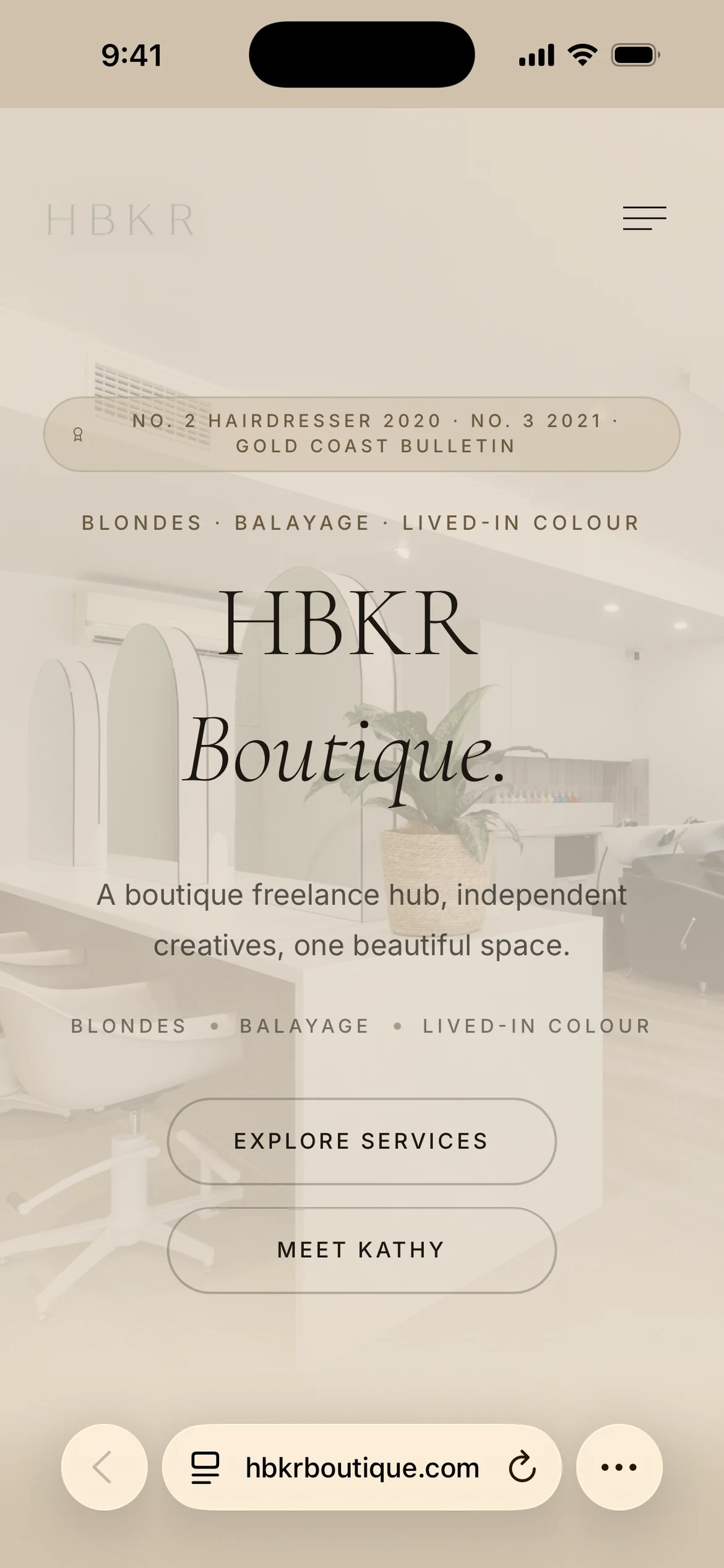 HBKR Boutique homepage with salon interior photography and service navigation, shown in a mobile browser view