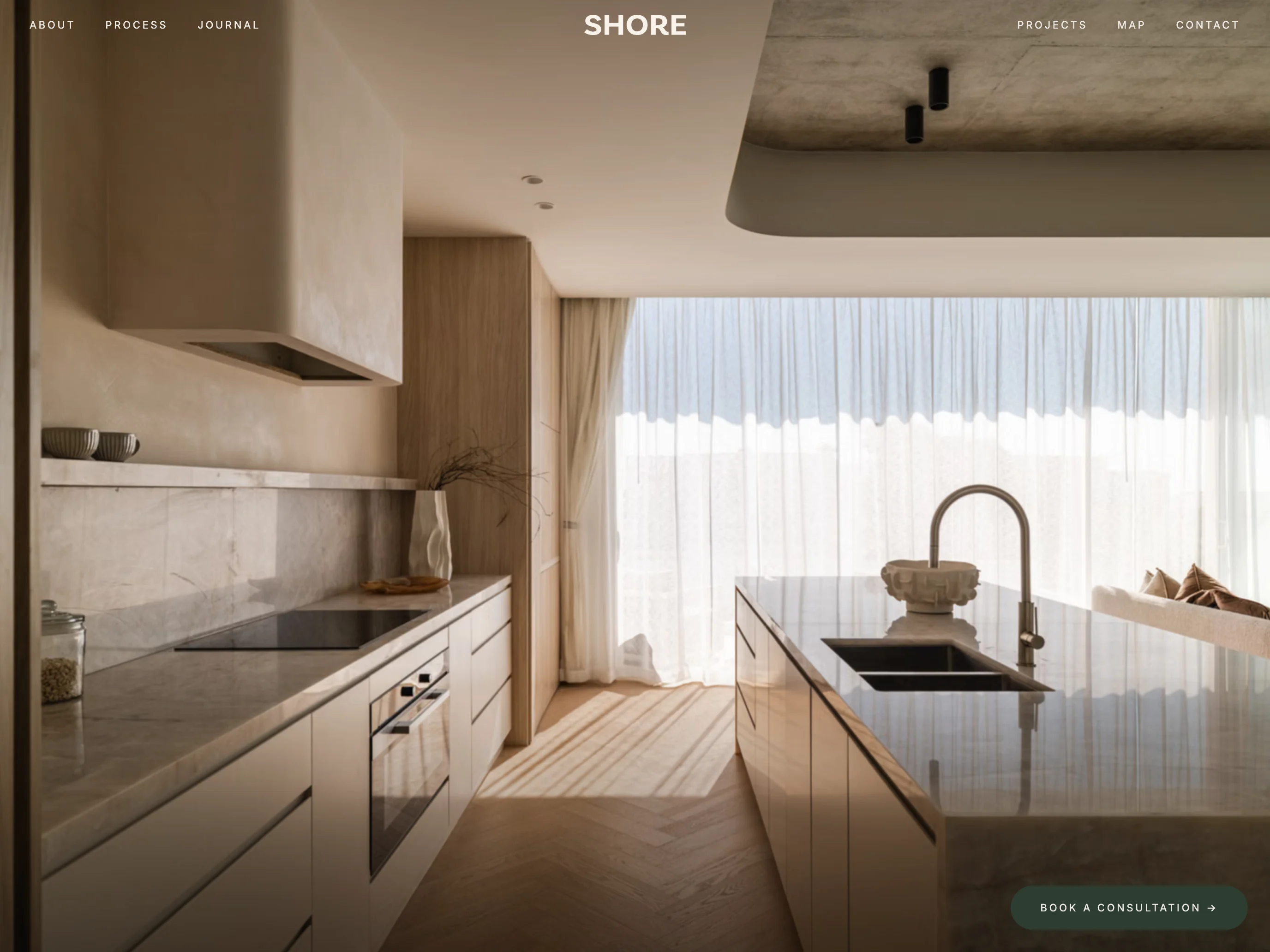 Landscape tablet view of the live SHORE website, showing its project photography and consultation link