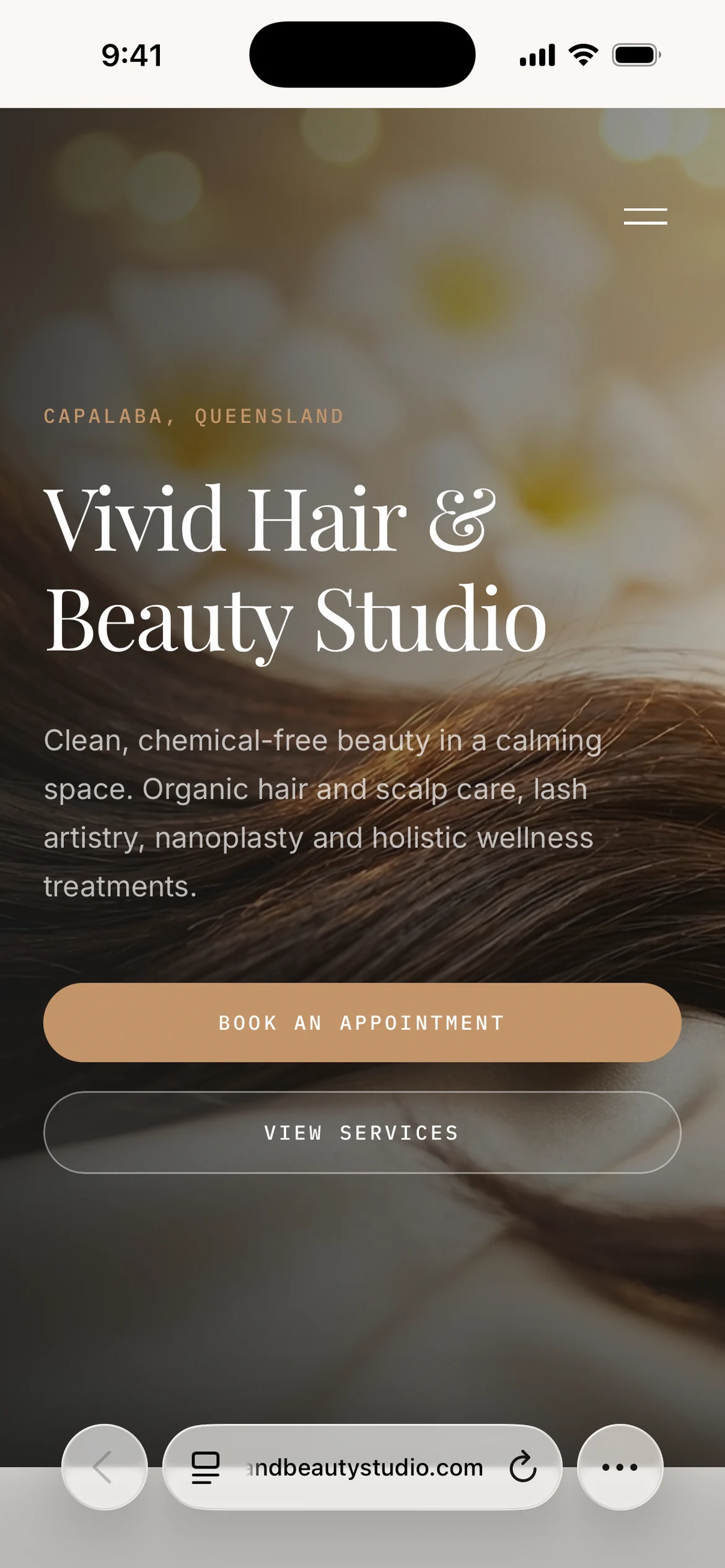 Vivid Hair and Beauty Studio homepage with hair photography and appointment and services links, shown in a mobile browser view